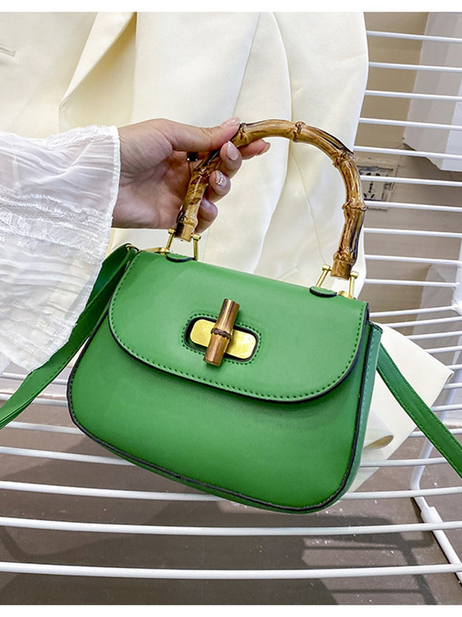 BOLSO VERDE DE MANO CON ASA DE BAMBÚ - EDICIÓN LIMITADA