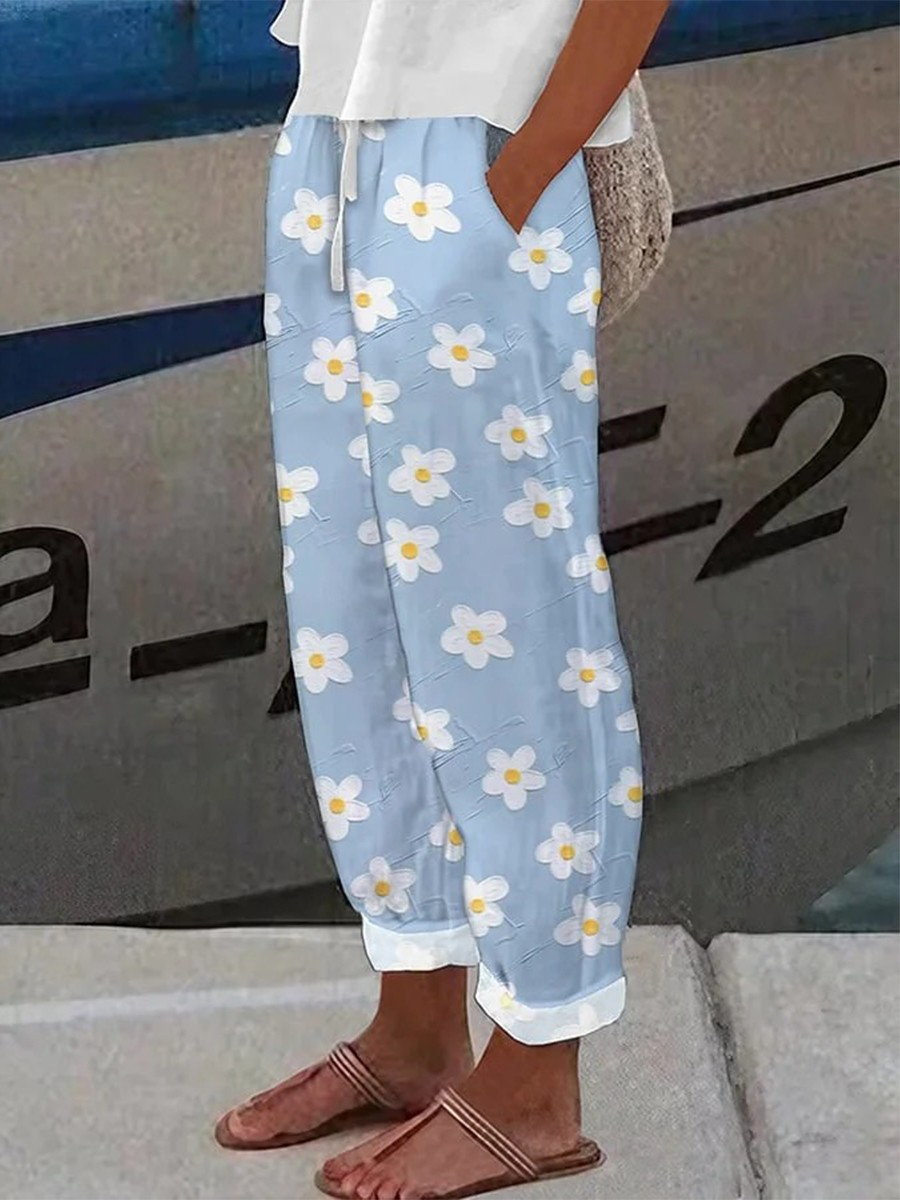 CLAUDIA - Loose-fitting floral print trousers