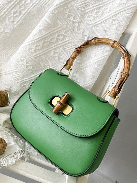BOLSO VERDE DE MANO CON ASA DE BAMBÚ - EDICIÓN LIMITADA